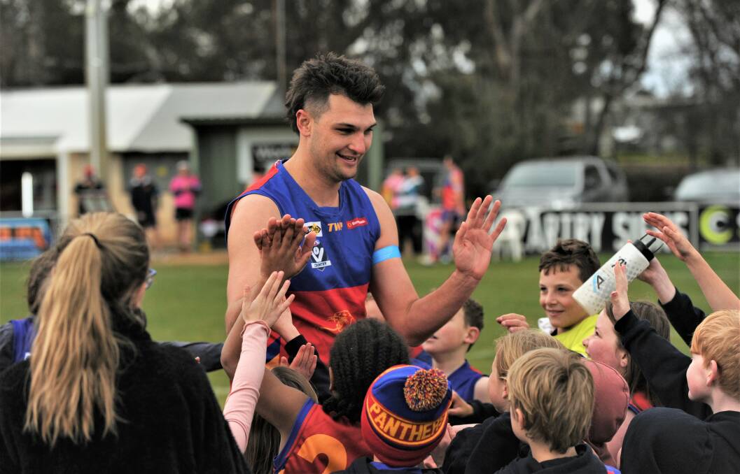 HIGH FIVES: Marong's Brandyn Grenfell celebrates his 100-goal milestone with young Panthers fans at Malone Park on Saturday. Picture: ANTHONY PINDA