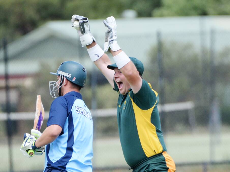 GOT HIM: Emu Creek wicket-keeper Brad Rowe celebrates the wicket of Sedgwick's Simon Marwood. Playing against his former team for the first time Marwood was dismissed for one, but the Rams were victorious at Club Court. Pictures: DARREN HOWE
