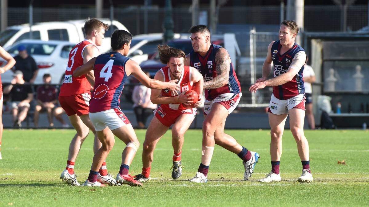 ENTERTAINING BATTLE: South Bendigo defeated Sandhurst by eight points at the QEO to regain the Graeme Wright Memorial Cup on Saturday.