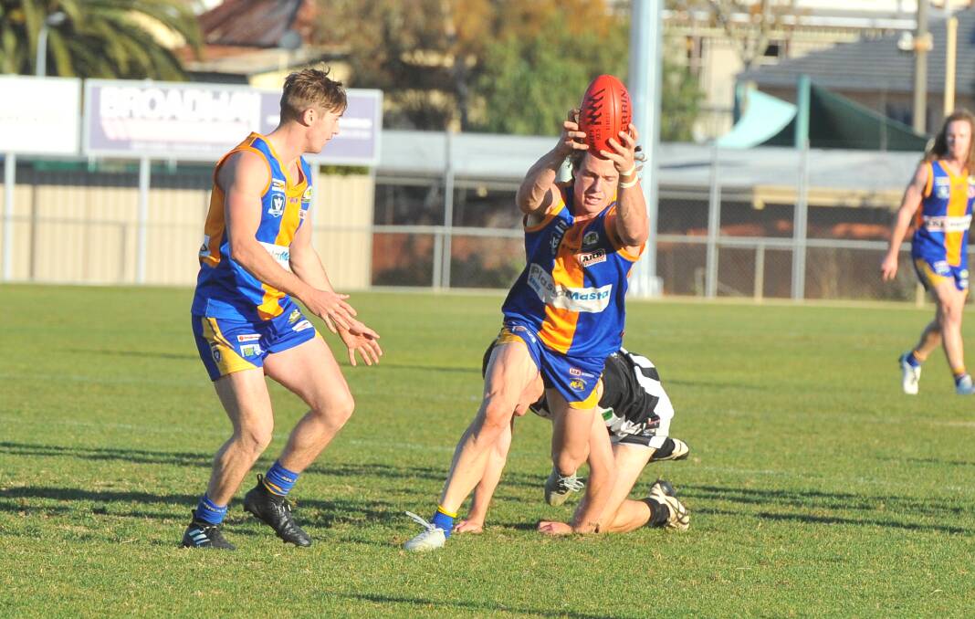 Golden Square co-captain Jack Geary marks in the third quarter against Castlemaine. Picture: LUKE WEST