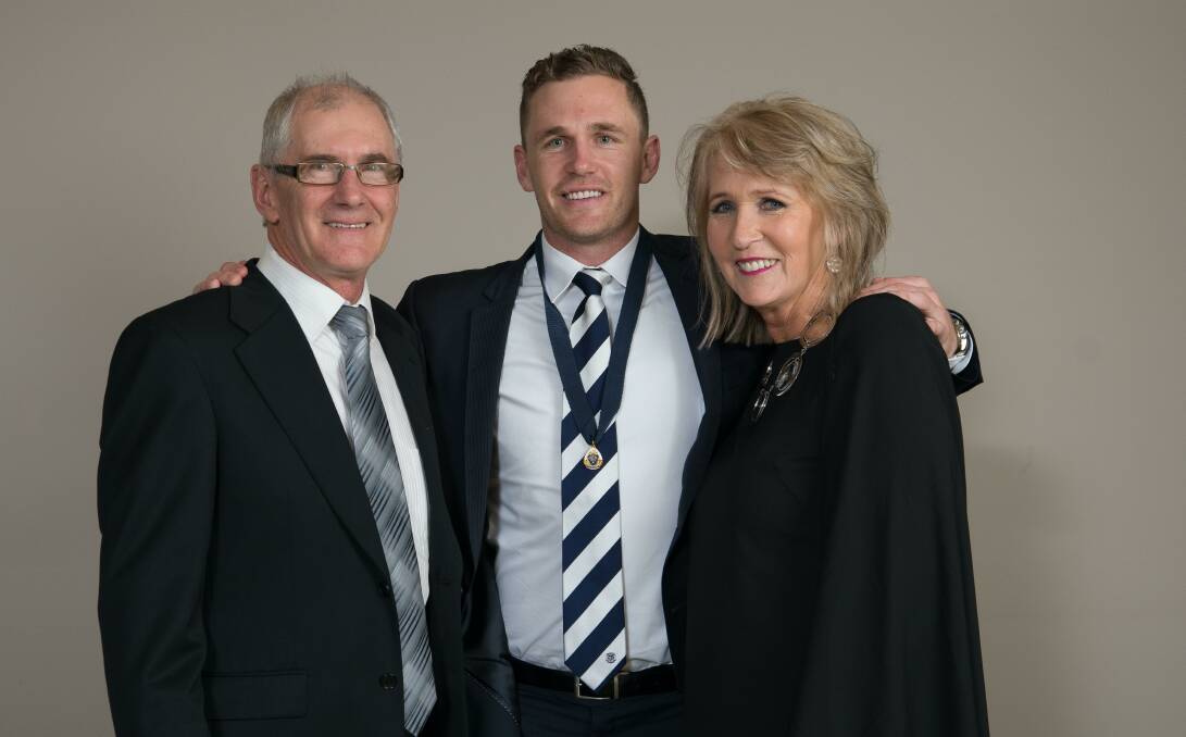 PROUD PARENTS: Bryce and Maree Selwood with son Joel after winning one of his three best and fairests for Geelong.