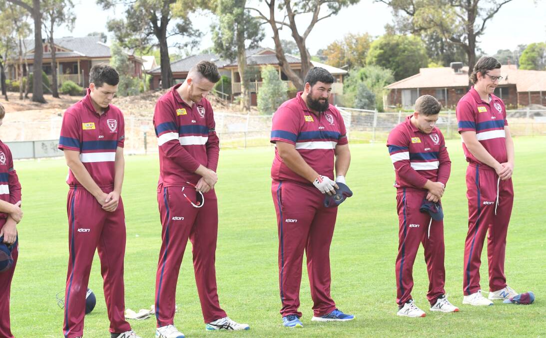 Sandhurst players observe a minute silence.