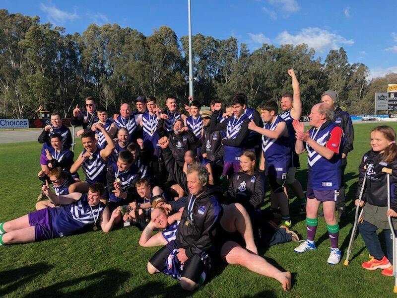 PREMIERS: The Bendigo Dockers celebrate their FIDA northern football conference grand final win last Sunday at Wangaratta. Picture: CONTRIBUTED