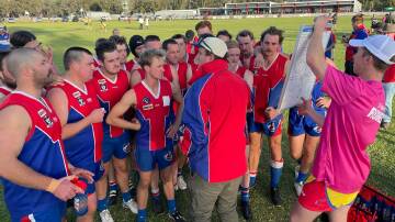 St Arnaud players listen to coach Torin Petrie at three quarter-time of Saturday's clash. Picture: ST ARNAUD FACEBOOK PAGE