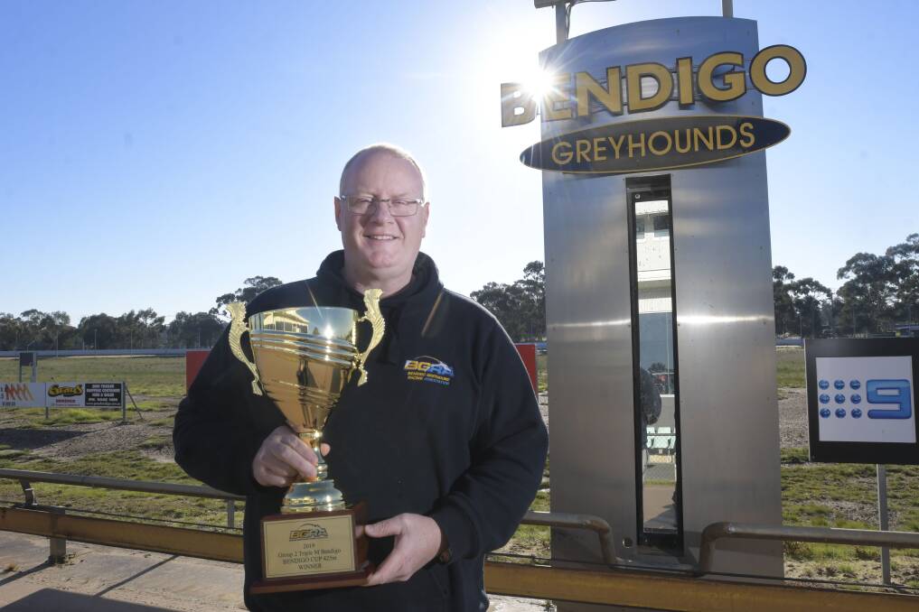 PRIZE UP FOR GRABS: Bendigo Greyhound Racing Club manager Troy Harley with the Bendigo Cup trophy. The Bendigo Cup will be run at Lord's Raceway on Friday night at 9.30pm, with Warrnambool's Crimson Vixen the runner to beat. Picture: NONI HYETT