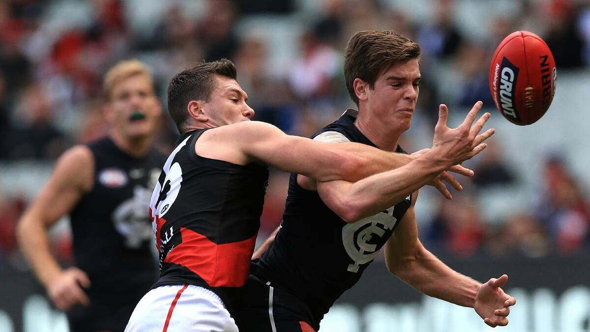 BLUES TRIUMPH: Carlton's Paddy Dow is tackled by Essendon's Conor McKenna at the MCG on Saturday. Picture: FAIRFAX MEDIA