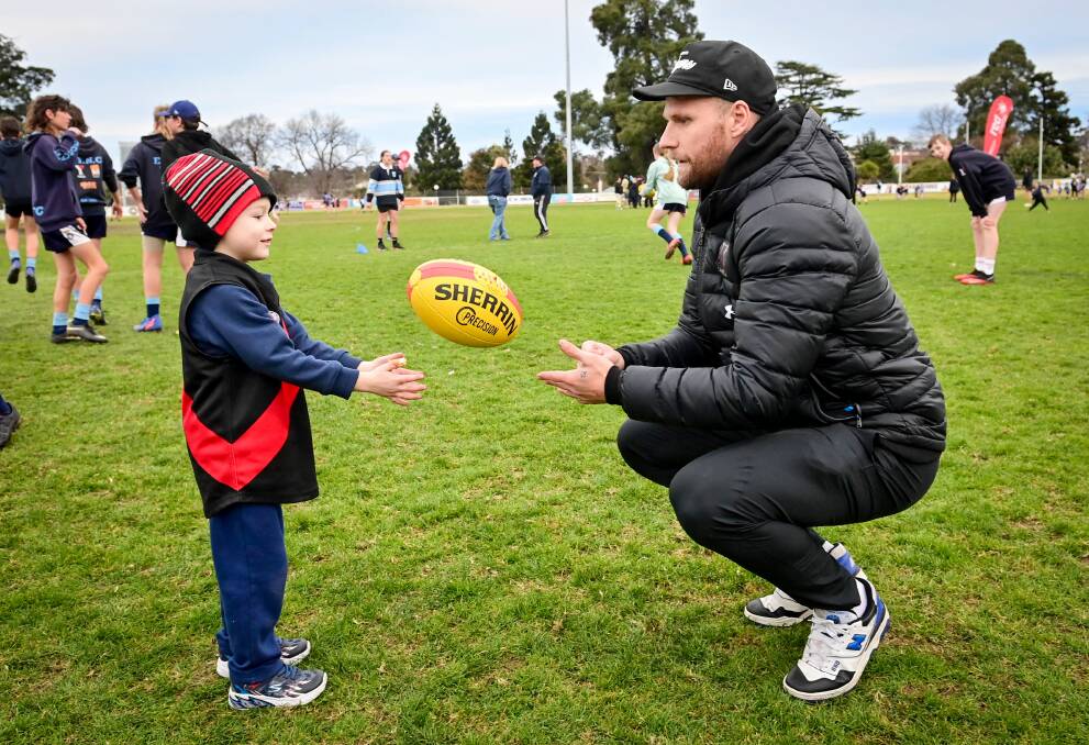CLINIC: Aiden Lawry with Jake Stringer at Eaglehawk on Tuesday night. Picture: BRENDAN McCARTHY