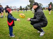 CLINIC: Aiden Lawry with Jake Stringer at Eaglehawk on Tuesday night. Picture: BRENDAN McCARTHY