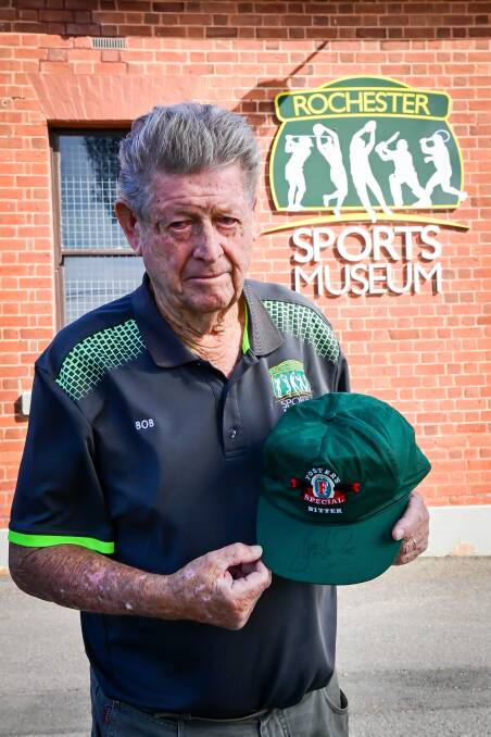 CHERISHED MEMORABILIA: Rochester Sports Museum's Bob Knight with the Foster's Bitter cap signed by Shane Warne to John Forbes. Picture: BRENDAN McCARTHY