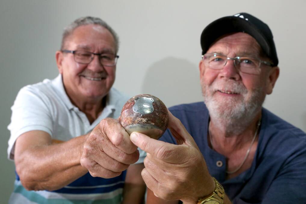 GOERS HISTORY: John Free with Bendigo Cricket Club's Larry Wust and the 1925 ball Charles Jennings took 7-3 with against South Bendigo. Picture: GLENN DANIELS