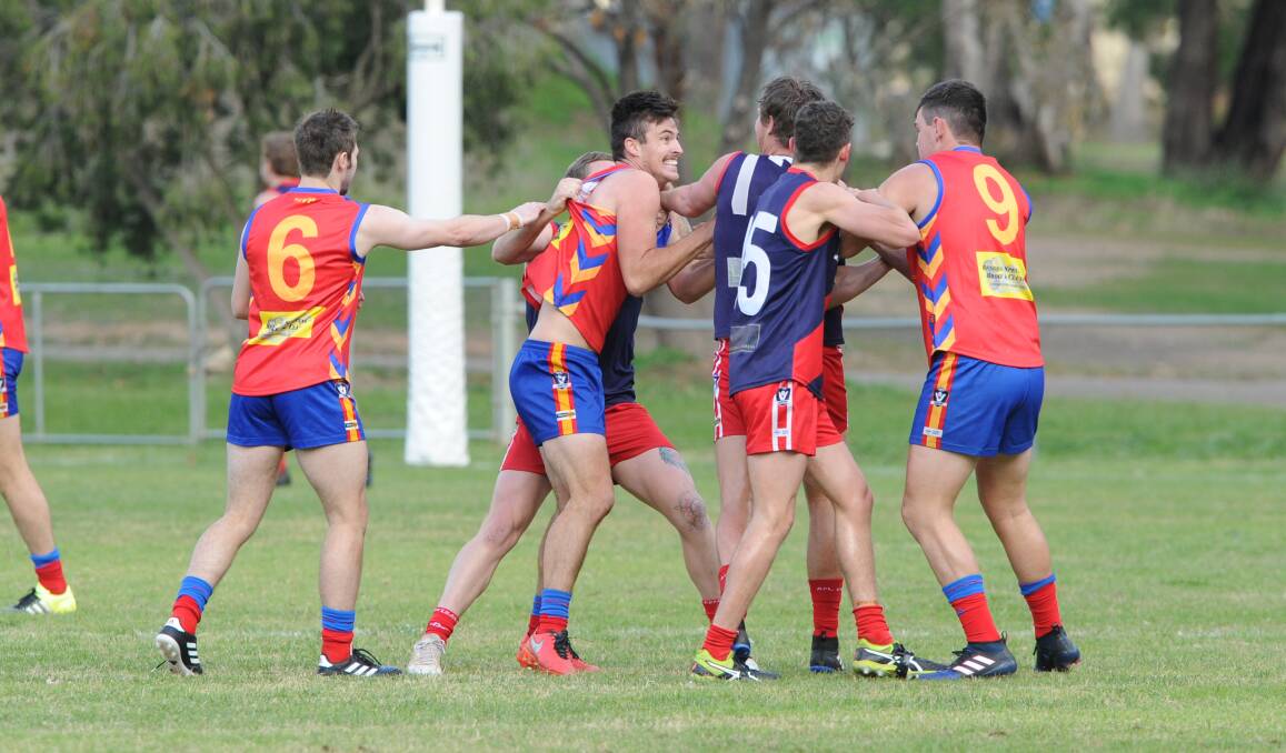 HEATED: Tempers flare during Saturday's match between Marong and Calivil United. The Demons won in a canter by 103 points to remain undefeated. Picture: NONI HYETT