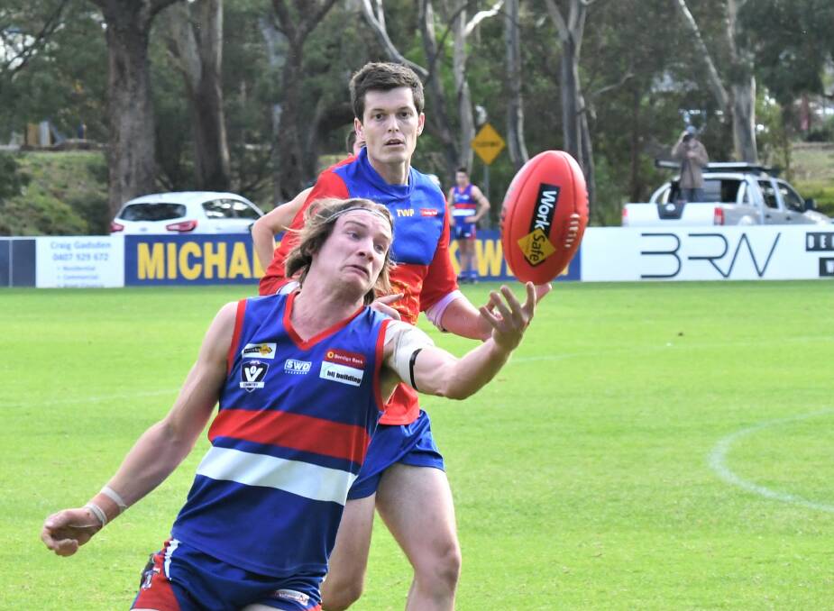 STRETCH: Pyramid Hill's Bailey George tries to haul in a one-handed mark during Saturday's win over Marong at Malone Park. Picture: ADAM BOURKE