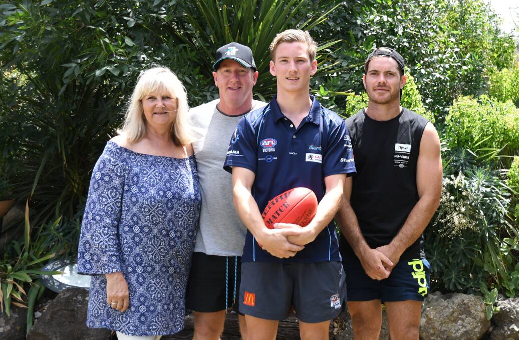 EXCITING TIMES: Port Adelaide draftee Kane Farrell with parents Sue and Stephen and brother Brodie after he was drafted last year. Picture: LUKE WEST