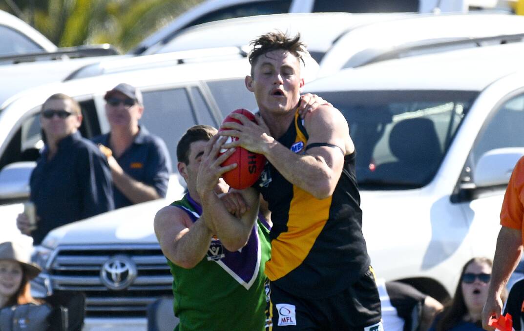 HARD-AT-IT: Star Sea Lake Nandaly Tigers' on-baller Trent Donnan. The reigning premier Tigers sit at the top of the NCFL ladder with a 6-0 record, but only just got over Birchip-Watchem by four points in the grand final re-match in round four. Eight of the NCFL's 24 games so far have been decided by a kick. Picture: NONI HYETT