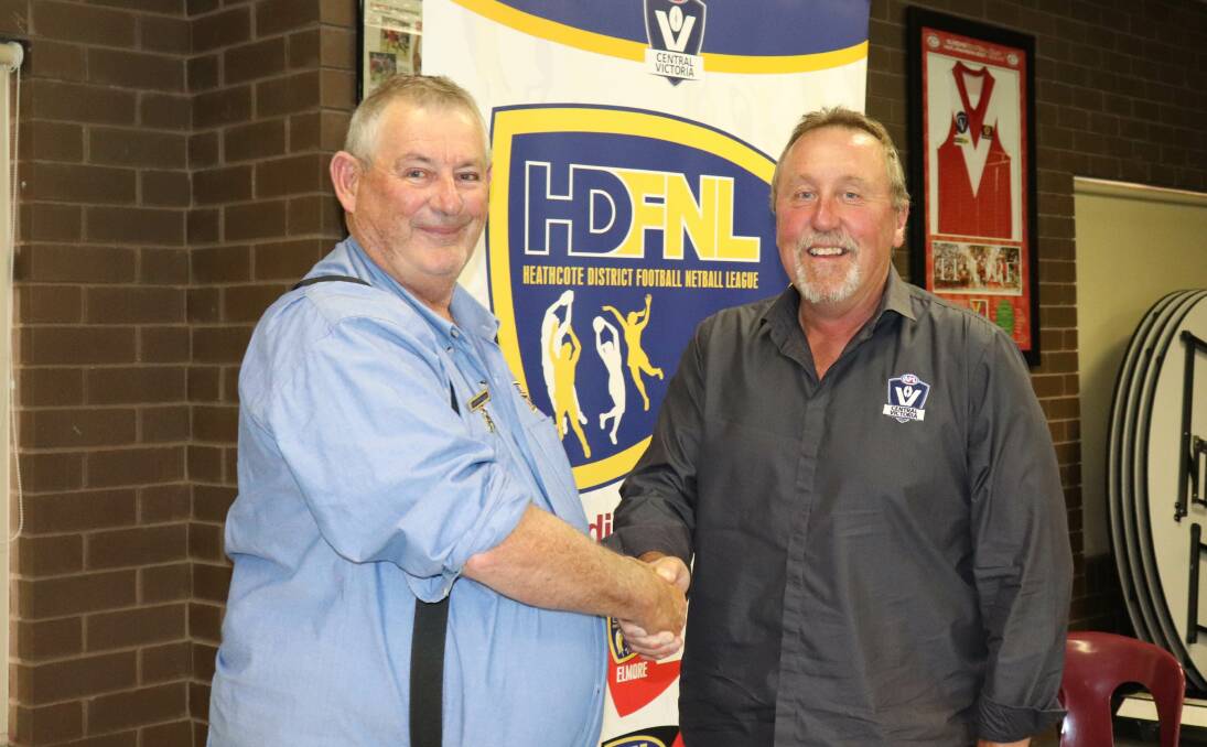 RECOGNITION: Ged McCormick is presented with his AFL Recognition of Service Medal by AFLCV commissioner Leon Holt at the HDFNL annual general meeting.