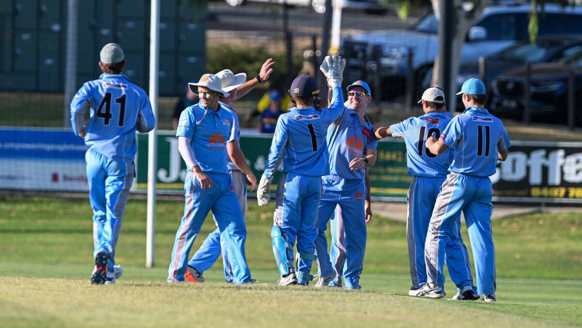 Strathdale-Maristians celebrate a wicket in Wednesday night's grand final. Picture by Enzo Tomasiello