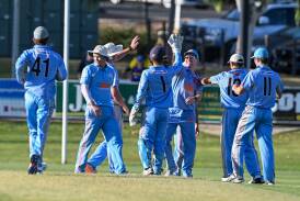 Strathdale-Maristians celebrate a wicket in Wednesday night's grand final. Picture by Enzo Tomasiello