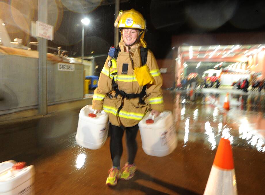 HARD YAKKA: Bendigo Thunder's Kaitlyn McIntosh gets a taste of what it's like to train for the Fire Brigade during Wednesday night's session. The Thunder plays the St Kilda Sharks on Sunday. Picture: NONI HYETT