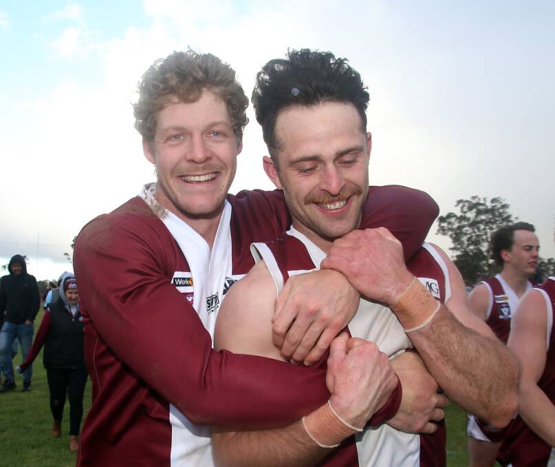 Newbridge forward Rhys Ford and captain Jordan Gilboy enjoy the post-match celebrations after the Maroons' grand final win over Mitiamo on Saturday. Picture: GLENN DANIELS