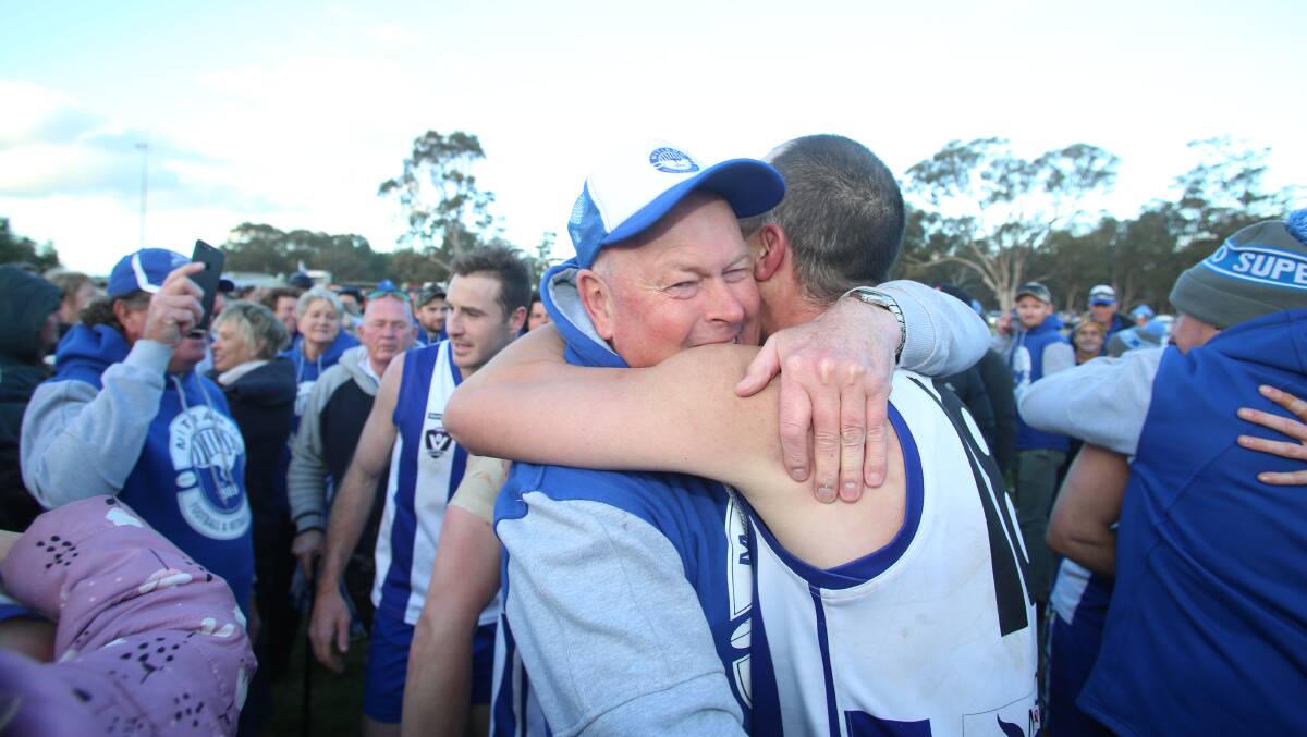 Mitiamo president Rob Clohesy hugs Ryan Wellington after Saturday's grand final win over Pyramid Hill. Picture: GLENN DANIELS