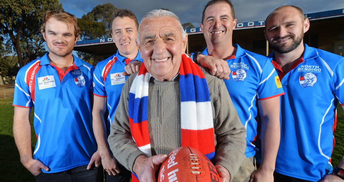 FOOTY FAMILY: North Bendigo stalwart Keith Robertson flanked by grandsons Ryan Alford, Sam Robertson, Rob Bennett and Shaun Kellow. Picture: DARREN HOWE