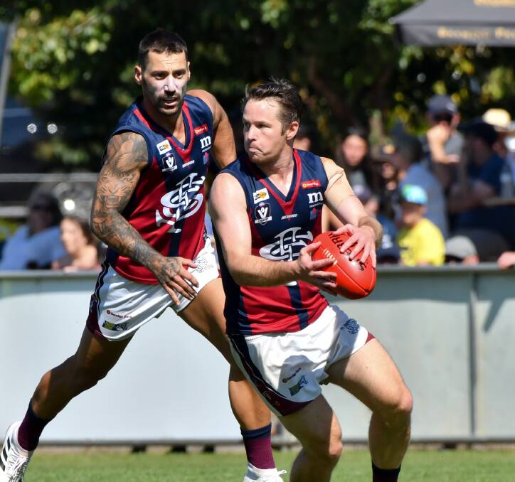 OFF TO A FLYER: Sandhurst's Lee Coghlan (with ball) and Brodie Montague. The Dragons are 2-0 and sitting on top of the BFNL ladder ahead of Saturday's match-of-the-round against Golden Square. Picture: NONI HYETT