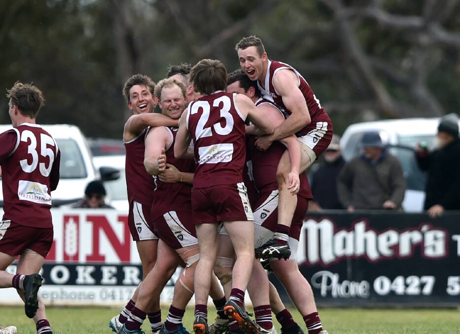 JUBILATION: Newbridge players celebrate at the final siren of the 2018 Loddon Valley league grand final after beating Mitiamo by 44 points.