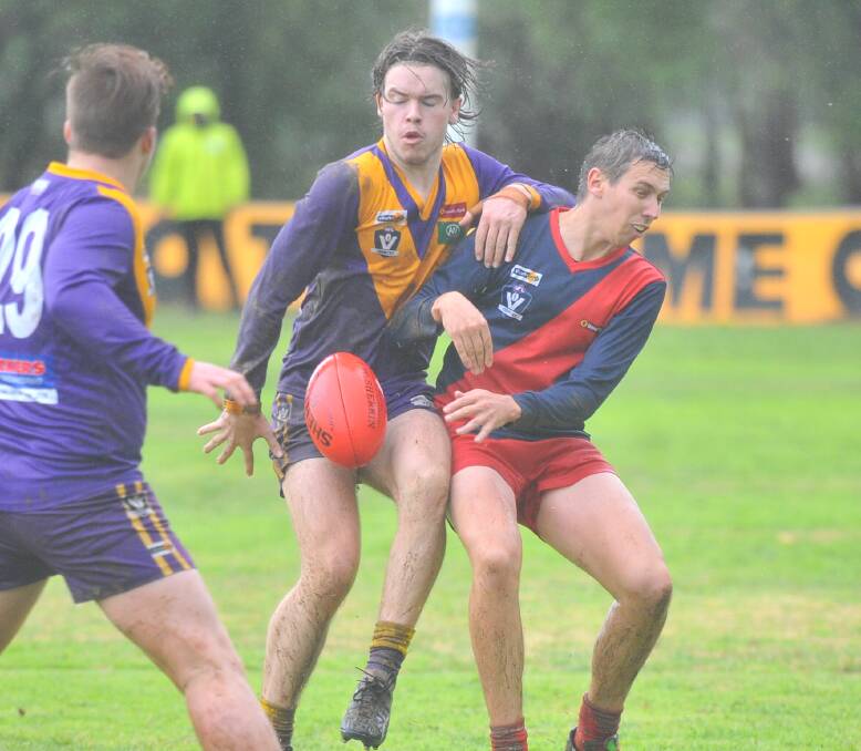 HARD YAKKA: Bears Lagoon-Serpentine's Harry Gadsden and Calivil United's Brock Rogers fight for possession on Saturday. The Bears won b 49 points at Serpentine to maintain third position. Picture: ADAM BOURKE