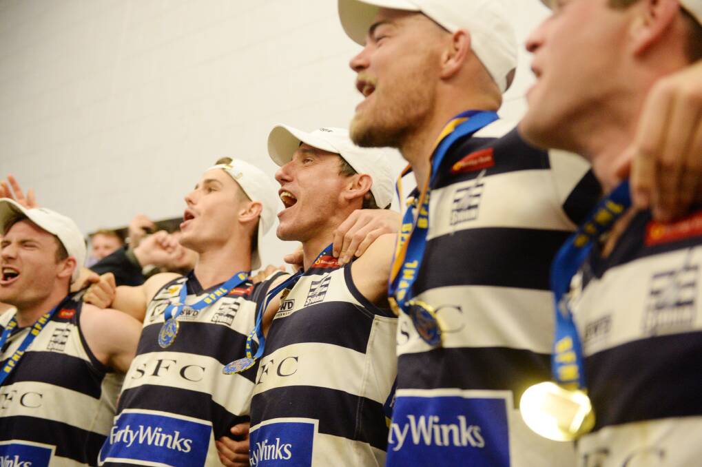 REDEMPTION: Strathfieldsaye players sing their club song after their 14-point grand final win over Eaglehawk last month. Picture: DARREN HOWE