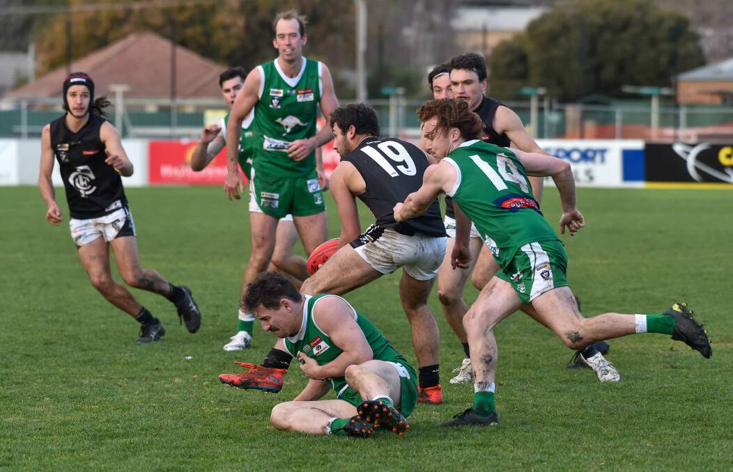 DOWER PARK TUSSLE: Castlemaine's Declan Slingo with possession of the ball during the Magpies' 51-point loss to Kangaroo Flat in round nine. Picture: PETER WEAVING