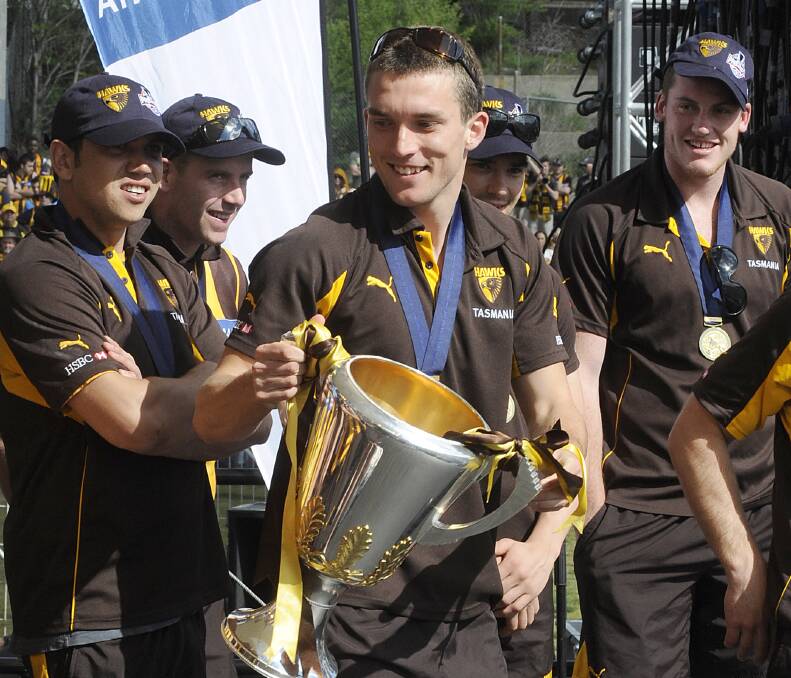 ULTIMATE PRIZE: Clinton Young holds the 2008 premiership cup at Glenferrie Oval the day after the grand final win against Geelong by 26 points.