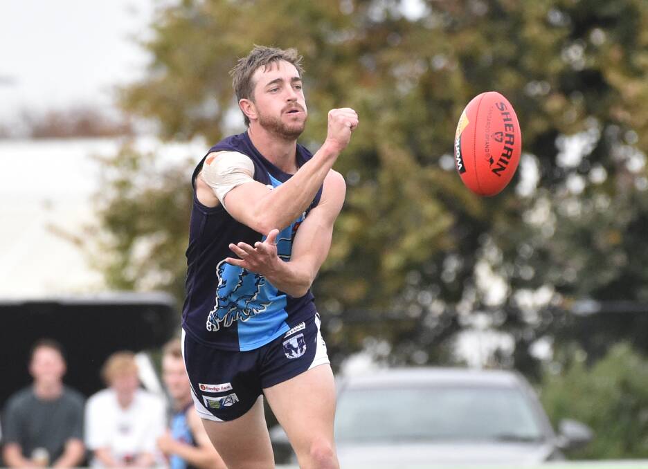 HARD AT IT: Eaglehawk's Clayton Holmes. The Hawks are home to Kyneton on Saturday. Picture: NONI HYETT