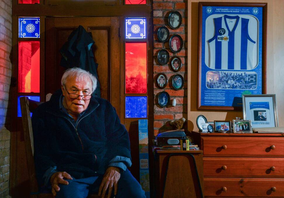 John Forbes with a 2009 Mitiamo premiership jumper in the background. Picture: BRENDAN McCARTHY