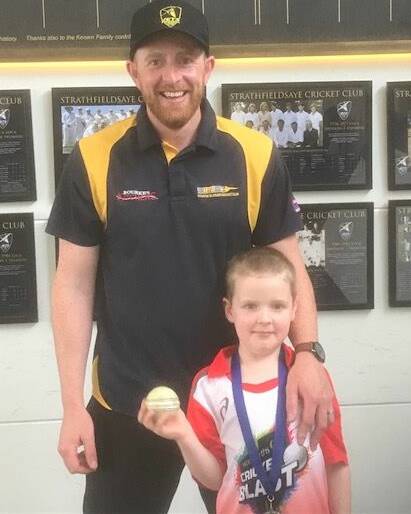 Strathfieldsaye's Justin Hargreaves with son Oscar after his hat-trick last Saturday.
