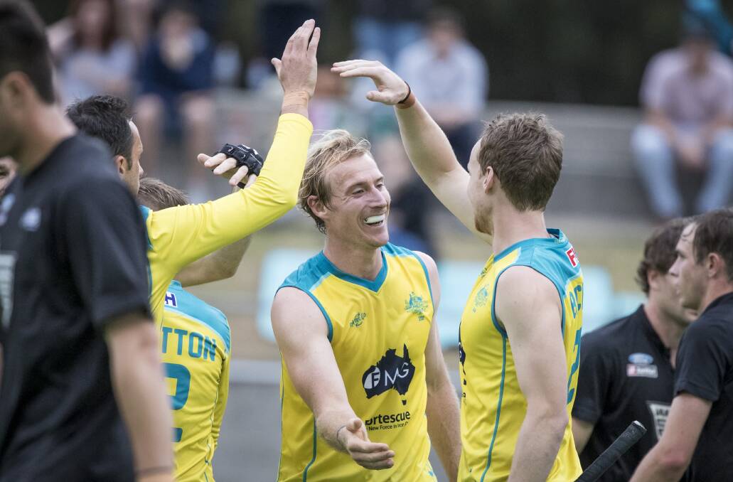 ALL SMILES: Aran Zalewski celebrates a goal last month for Australia against New Zealand.