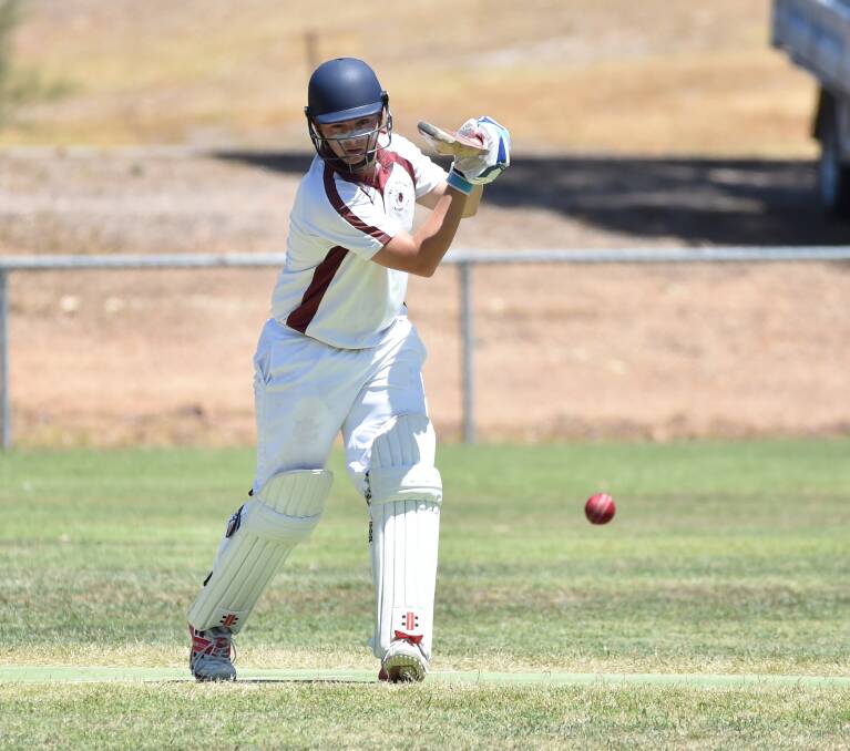 ON THE FRONT FOOT: West Bendigo's Tom Floyd bats against Maiden Gully on Saturday. The Redbacks were all out for 148, before the Lions went to stumps at 4-117.