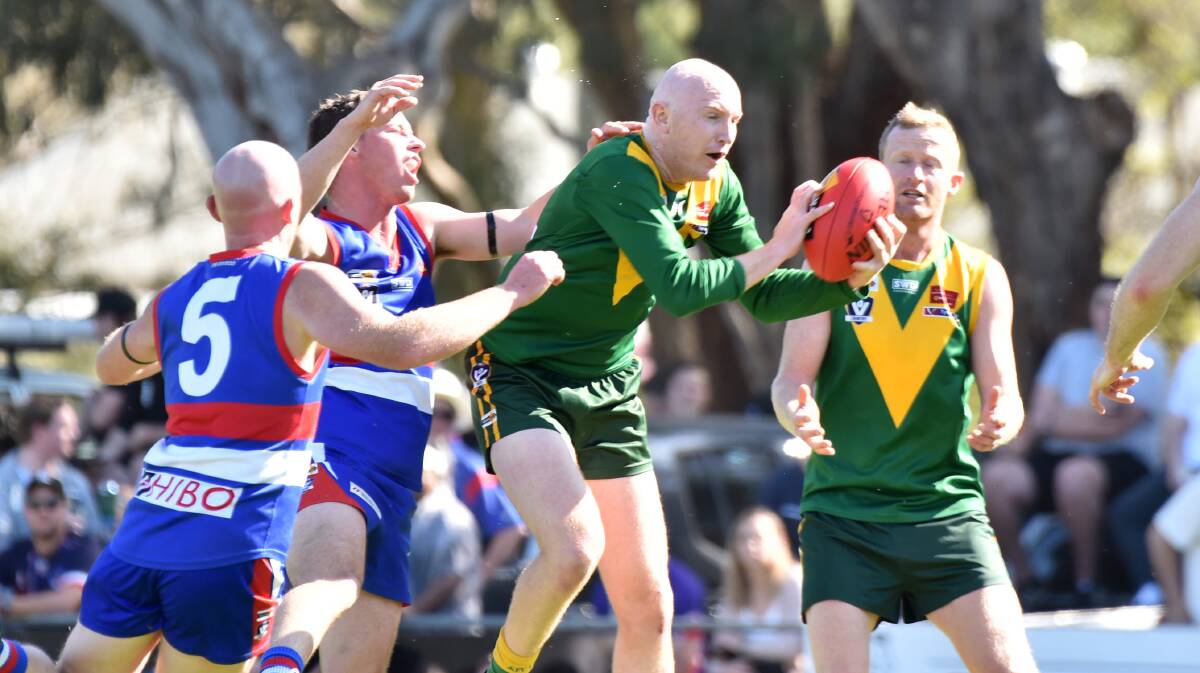 BATTLED HARD: On-baller Lachlan Ezard was one of the best for Colbinabbin in Saturday's grand final loss to North Bendigo. The Bulldogs won by 36 points.