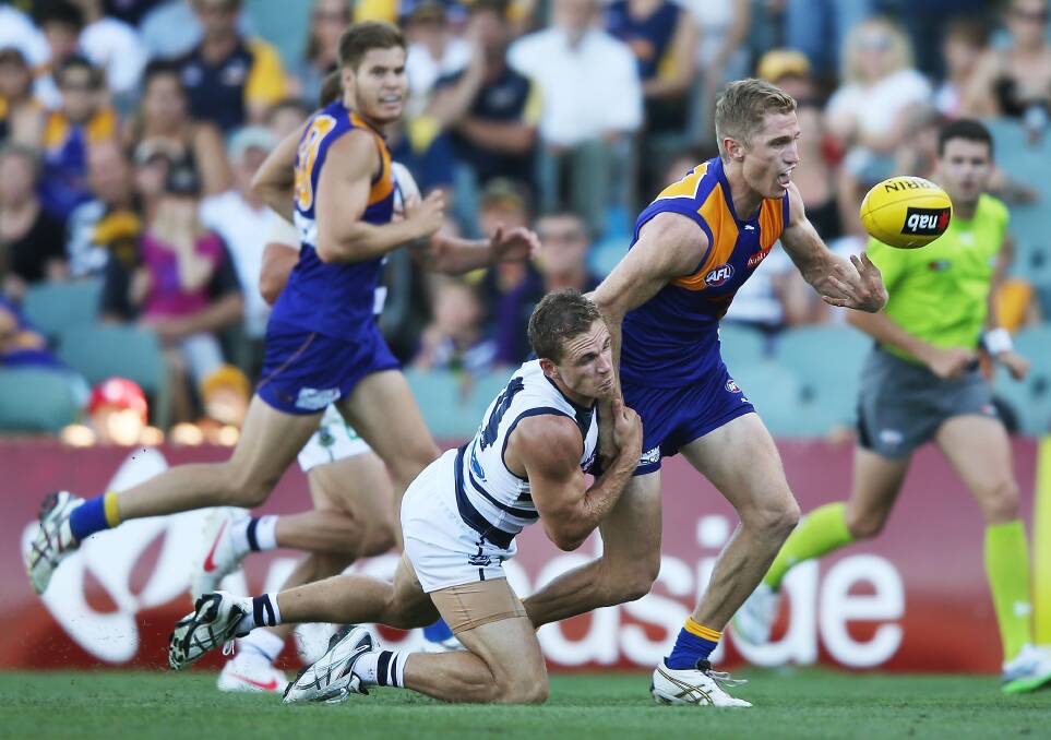 SIBLING RIVALRY: Adam Selwood is tackled by younger brother Joel in an AFL pre-season match between West Coast and Geelong in 2013. Picture: GETTY IMAGES
