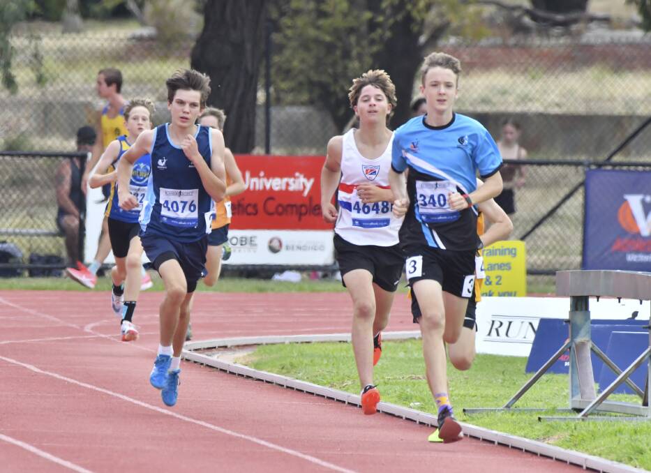 HARD YARDS: Action from the heats of under-18 boys 800m on Sunday at the Victorian Country Track and Field Championships in Bendigo. Picture: NONI HYETT