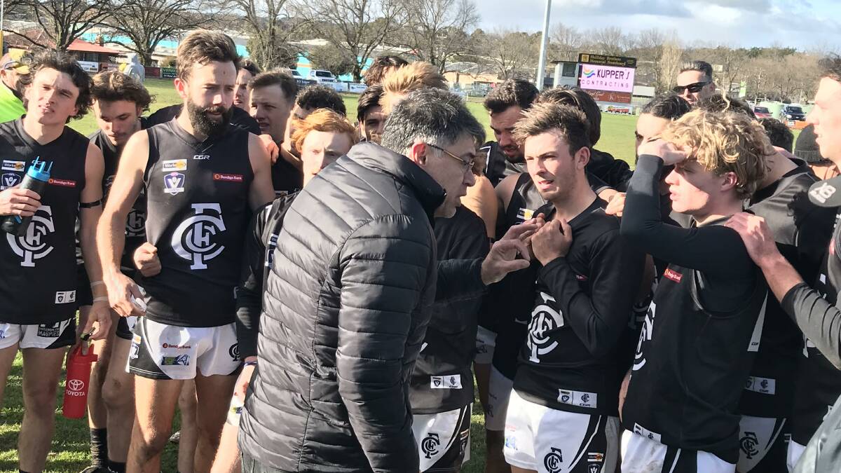 INSTRUCTIONS: Castlemaine co-coach Derrick Filo addresses his players at quarter-time during the round 12 game against Kyneton. The Magpies are still chasing their first win of the 2019 season. They take on Sandhurst at the QEO this Sunday. Picture: LUKE WEST
