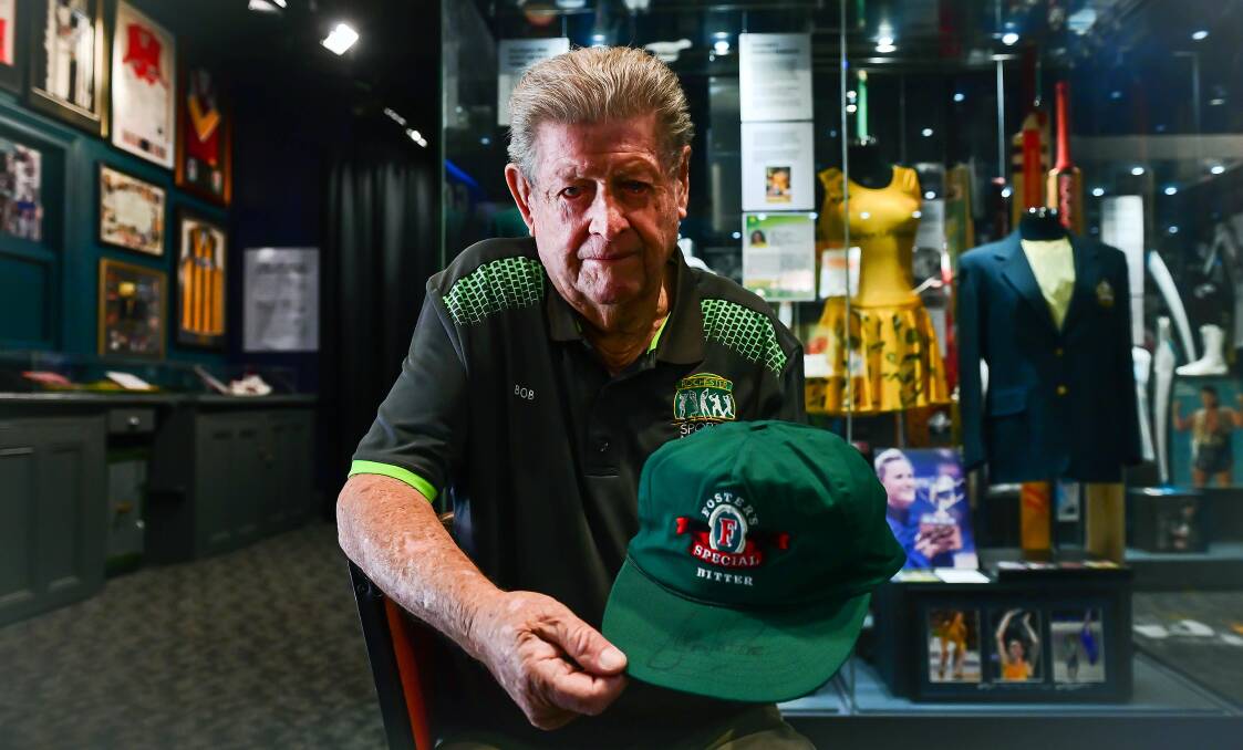 CHERISHED MEMORABILIA: Rochester Sports Museum's Bob Knight with the Foster's Bitter cap signed by Shane Warne to John Forbes. Picture: BRENDAN McCARTHY
