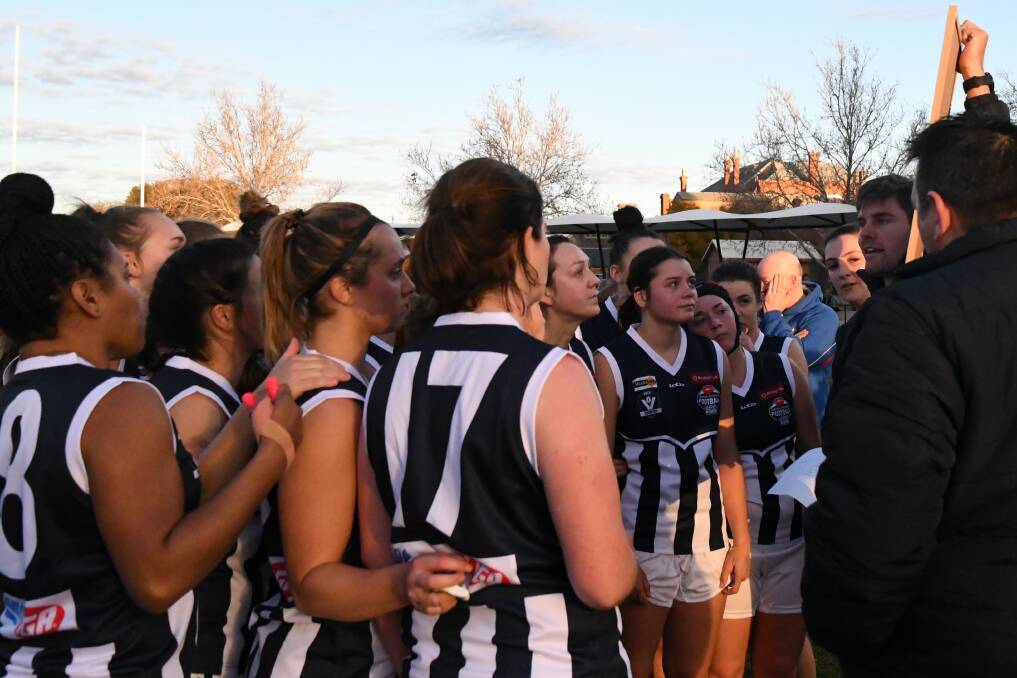 IN TIGHT: Central Victorian players listen to coach Hamish Morcom at quarter-time of Sunday's inter-league match at the QEO. Picture: LUKE WEST