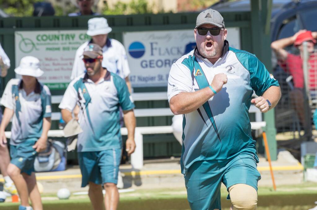 UP AND ABOUT: Bendigo East skipper Marc Smith on one of his customary runs down the green.