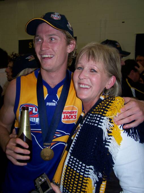 MEMORABLE DAY: Adam Selwood and mum Maree celebrate in the Eagles' rooms after the 2006 grand final win over Sydney at the MCG.
