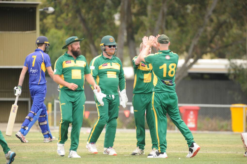 ROOS ON TOP: Kangaroo Flat players celebrate the wicket of Golden Square's Scott Trollope in Saturday's dominant win at Dower Park. Picture: LUKE WEST