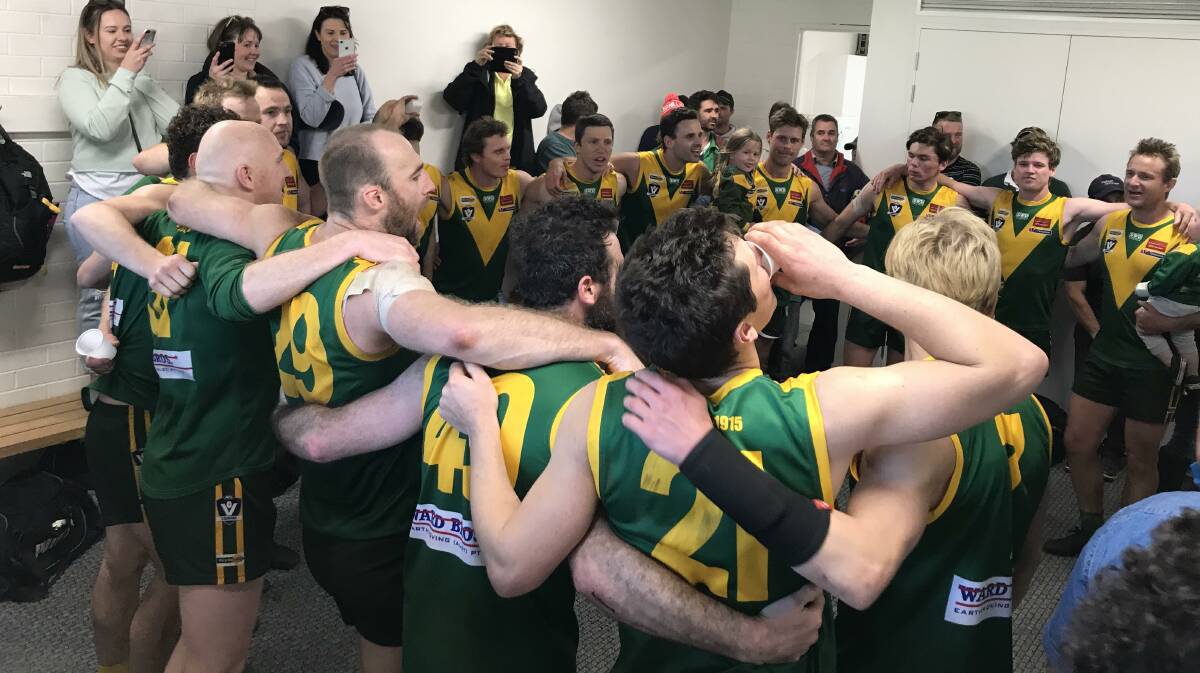 UP AND ABOUT: Colbinabbin players sing their team song after Saturday's second semi-final win over North Bendigo. Pictures: LUKE WEST