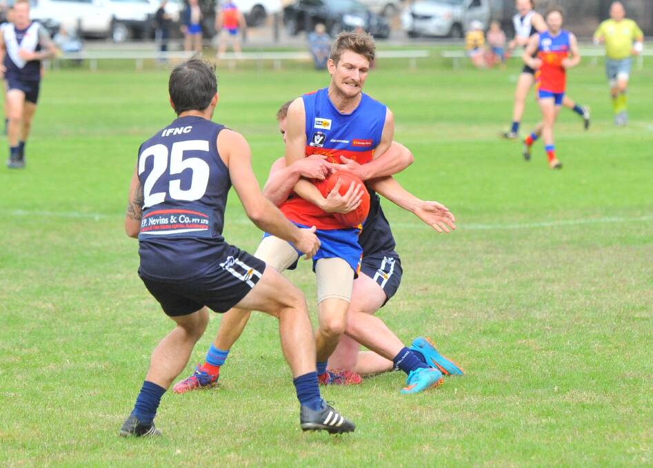 GOTCHA: Marong's Brenton Pyper is tackled by Inglewood's Ben Smith during Saturday's Loddon Valley clash won by the Panthers. Picture: ADAM BOURKE