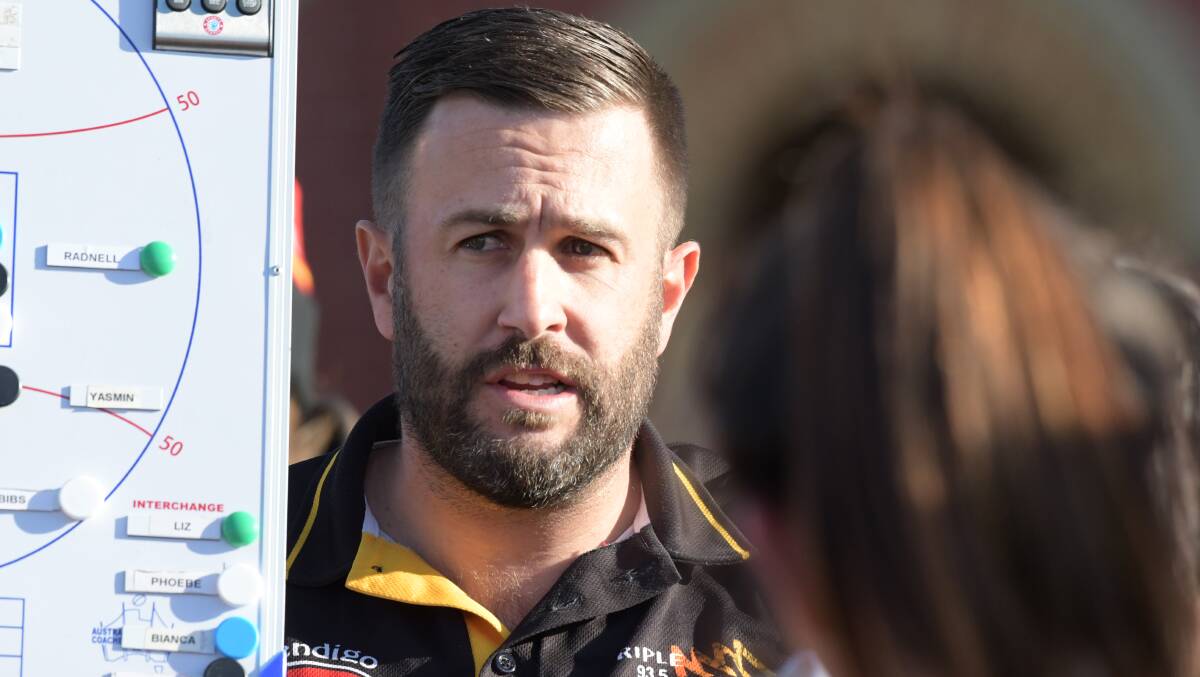IN CHARGE: Bendigo Thunder coach Luis Alvarez-Harris addresses his players at quarter-time, at which stage his side was three goals in front of Diamond Creek.
