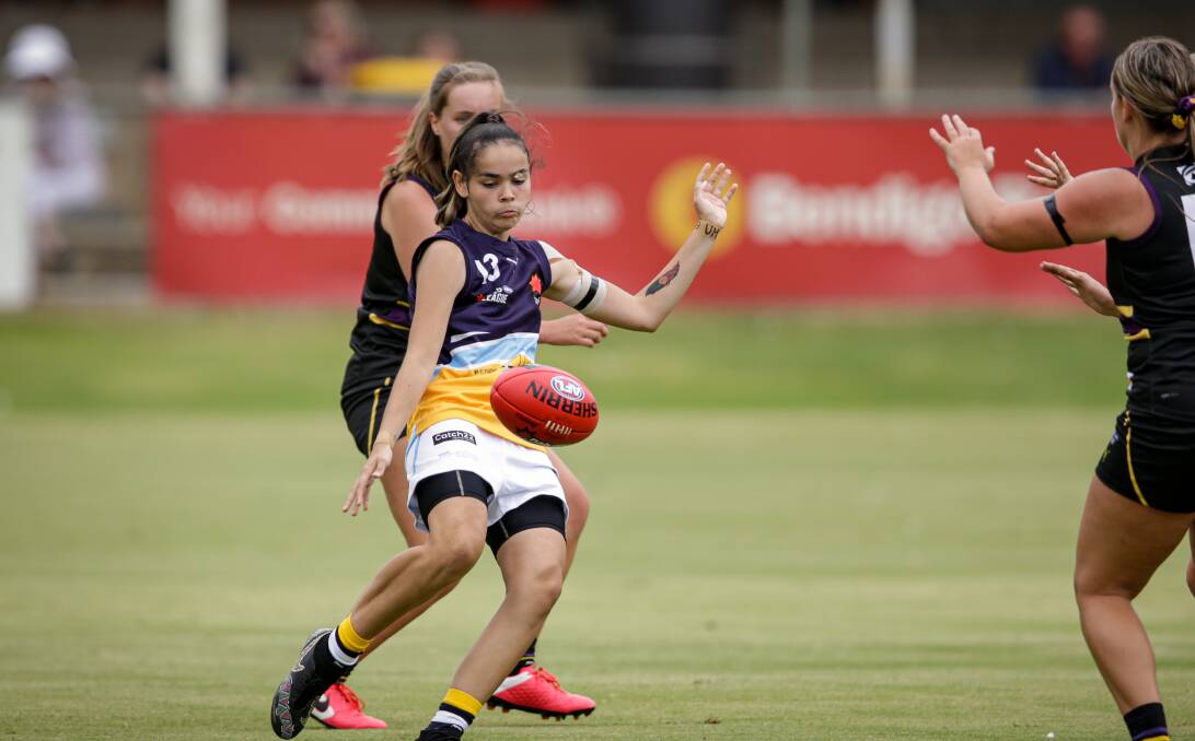 POSITIVE START: Chantelle Mitchell gets a kick away for the Bendigo Pioneers against the Murray Bushrangers in round one. The Pioneers opened their NAB League girls season with a 26-point victory at Yarrawonga. Picture: JAMES WILTSHIRE, BORDER-MAIL