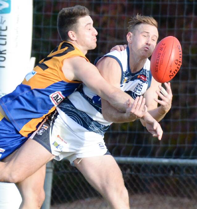 KEY DEFENDER: Will Lee, pictured spoiling Strathfieldsaye's Lachlan Sharp, has been a key cog in the Golden Square backline since 2017. He's headed back to Cohuna in the Central Murray league. Picture: DARREN HOWE